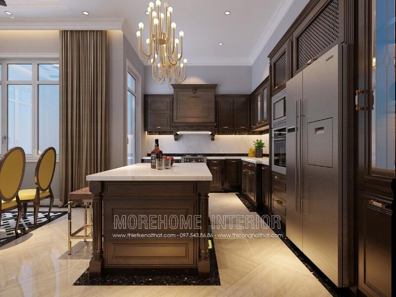Mẫu thiết kế tủ bếp gỗ óc chó tại Hà Nội phong cách tân cổ điển với những đường nét hoa văn chạm khắc đầy tinh tế, không quá cầu kỳ nhưng vẫn mang lại vẻ đẹp nổi bật khác biệt riêng với cổ điển truyền thống hay hiện đại trẻ trung Tủ bếp gỗ, tủ bếp gỗ tự nhiên, tủ bếp tân cổ điển
